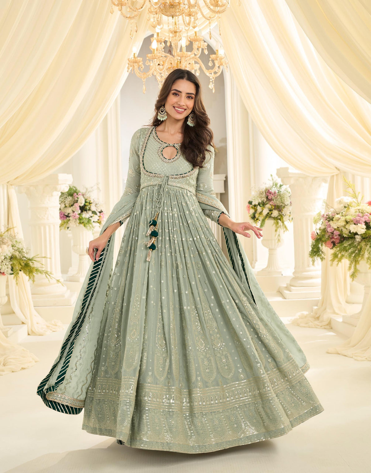 Model wearing the saira chikankari gown set - sage green.